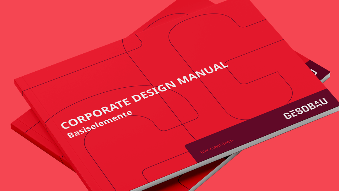 Rotes Corporate Design Handbuch f&uuml;r GESOBAU, mit klarer Typografie und minimalistischem Design auf einem einfarbigen roten Untergrund.